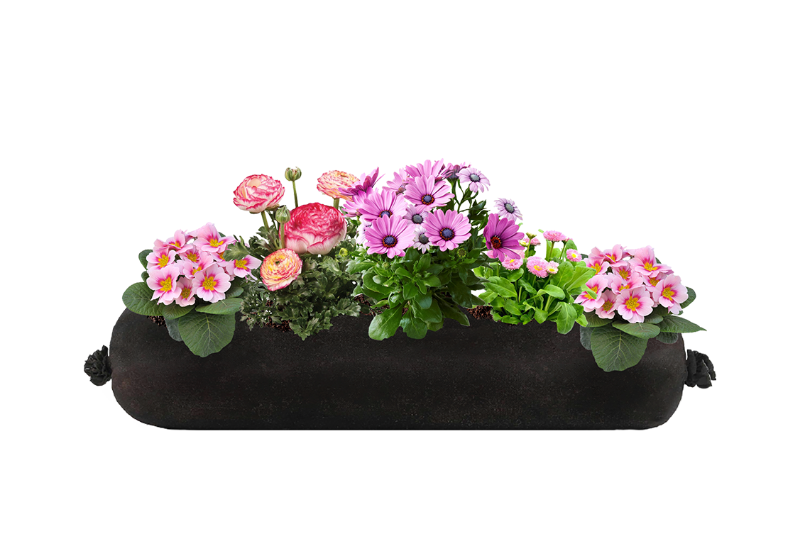 Long black fabric planter insert with pink flowers on a white background.
