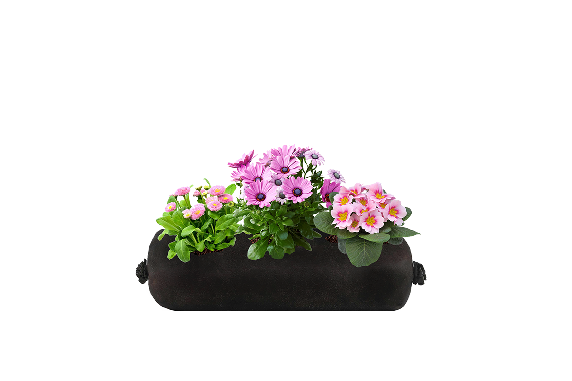 A small black fabric planter refill insert with pink flowers on a white background.