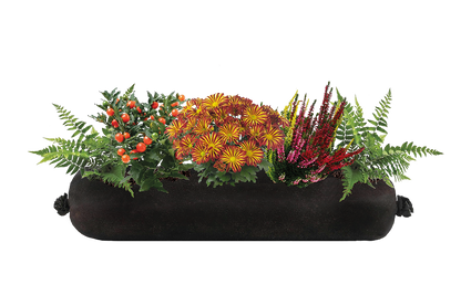 Black planter with colorful flowers and greenery on a white background