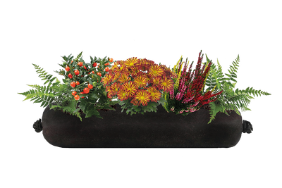 Black planter with colorful flowers and greenery on a white background