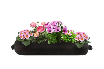 Long black fabric planter insert with pink flowers on a white background.