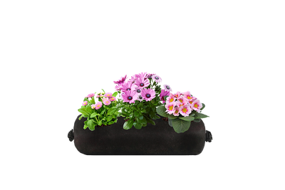 A small black fabric planter refill insert with pink flowers on a white background.