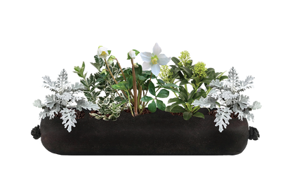 Decorative planter with greenery and white flowers on a white background