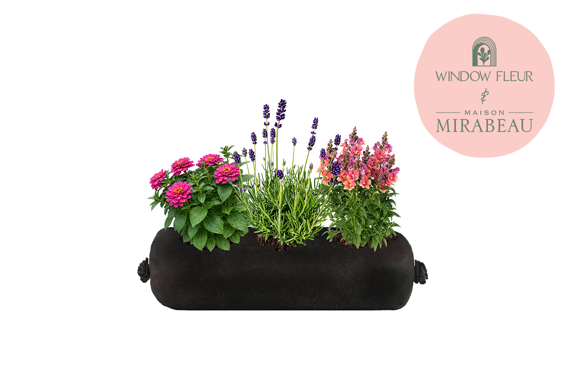 Black fabric planter with flowers and plants on a white background, featuring the Maison Mirabeau logo.