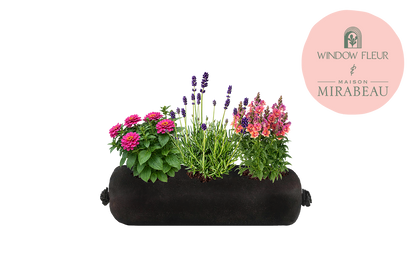 Black fabric planter with flowers and plants on a white background, featuring the Maison Mirabeau logo.