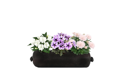 Black fabric planter with colorful flowers on a white background